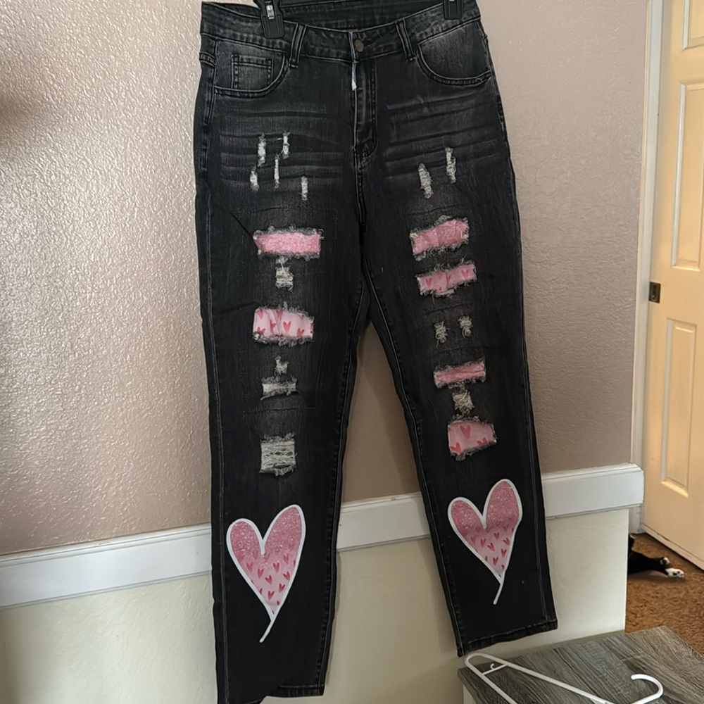 Brand new women’s size 12 Valentines Day black jeans with pink hearts